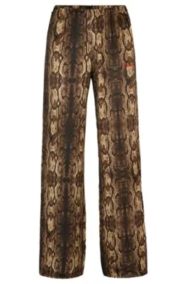 Pajama bottoms in satin with snake print